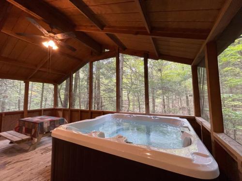 Cabin 3 Hot Tub on screen porch